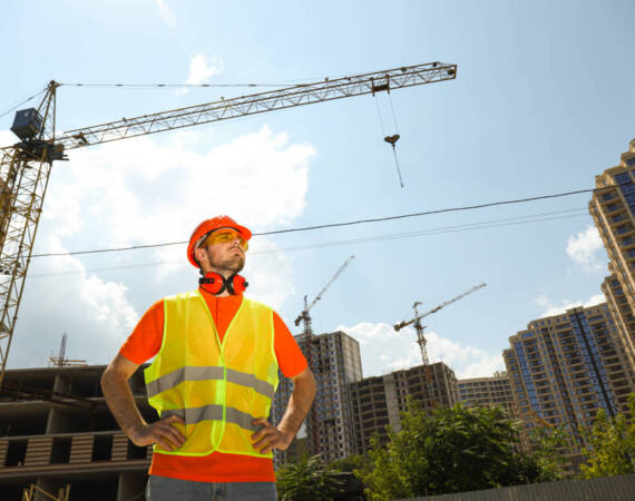 Young man civil engineer in safety hat